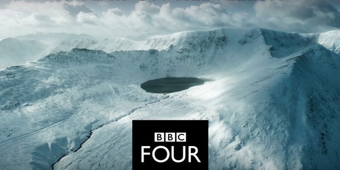 an aerial shot of a snow-clad Helvellyn in the Lake District. with the BBC Four icon